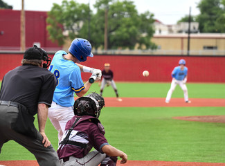 Young athletic boys playing sport of baseball