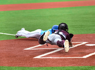 Young athletic boys playing sport of baseball