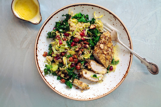 Quinoa, brussel sprouts, crispy kale and hazelnuts salad with dukkah crusted chicken 