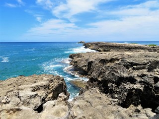 Fototapeta na wymiar Rocky coast line of Leie Point, a popular tourist attraction on the North Shore of Oahu, Hawaii
