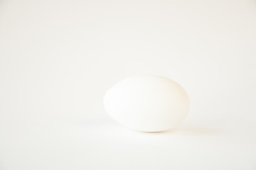 there is an egg on a white table