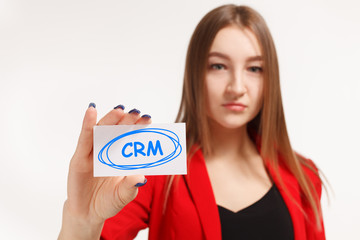 Business, technology, internet and networking concept. Young entrepreneur showing keyword: CRM