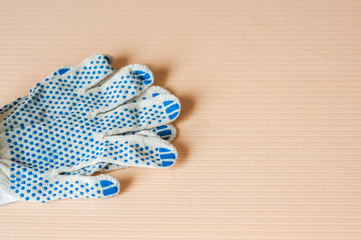 Fototapeta na wymiar Work gloves with blue rubber dots