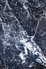 texture of black a marble or tile with white stains and patterns