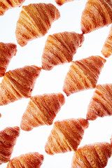 Diagonal baked goods pattern on a light background.