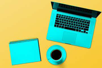 a modern laptop computer  isolated on the turquoise background