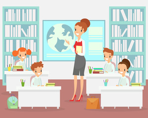 Vector illustration of teacher in classroom with kids. Teacher with children in elementary school class, preschool studying. Happy and smiley kids sitting at the desks in class, cartoon flat style.