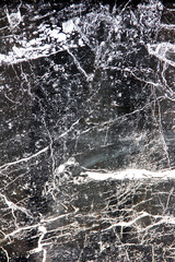 texture of black a marble or tile with white stains and patterns