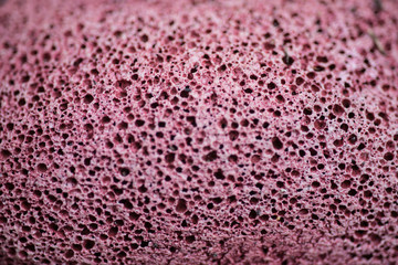 Many porous red concrete surfaces