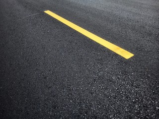 Road traffic paint Yellow on the asphalt surface