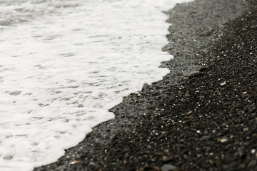 storm on the seashore , the wave washes the stones