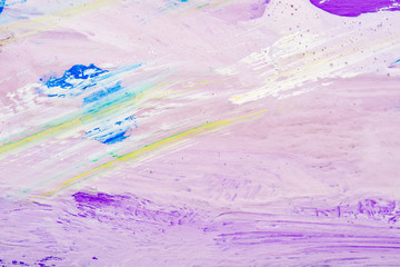 abstract background of different colors paint smeared on the surface of the canvas