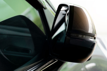 Fototapeta premium The car side mirrors that have been folded when parked.