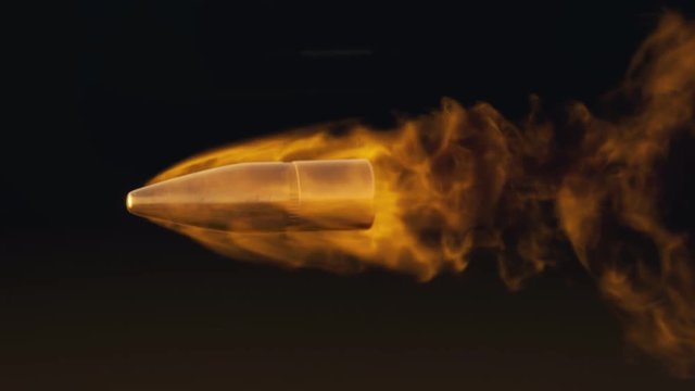 Slow motion shot of shooted bullet with fiery trail. Fire ammunition in slomo.