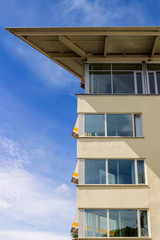 Office facade against a blue sky