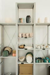 Cabinet with ceramic dishes in the Studio