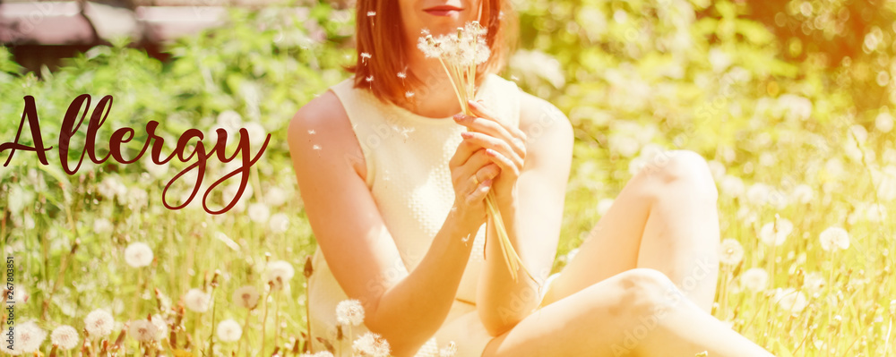 Wall mural allergy dandelions. The girl is holding dandelions. walk in nature. space for text. summer park