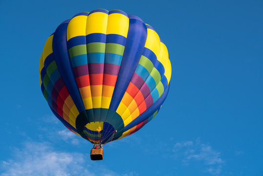 Colorful of balloon on blue sky with copy space