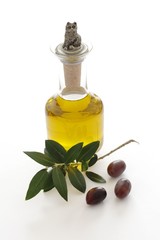 Olive oil in a bottle and kalamata olives