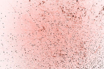 Vintage pink background. Rough painted wall of living coral color. Imperfect plane of beige colored. Uneven old decorative toned backdrop of beige tint. Texture of pink hue. Ornamental stony surface.