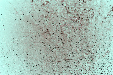 Vintage cyan background. Rough painted wall of hazel color. Imperfect plane of brown colored. Uneven old decorative toned backdrop of blue tint. Texture of azure hue. Ornamental stony surface.