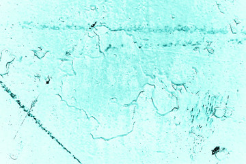 Vintage azure background. Rough painted wall of turquoise color. Imperfect plane of cyan colored. Uneven old decorative toned backdrop of aqzure tint. Texture of teal hue. Ornamental stony surface.