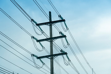 Electric pole for power height volt cable under blue sky in Thailand.