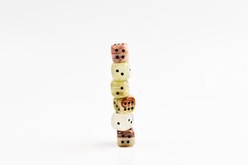Dices made of natural stone on a white background. Copy space. Gaming.