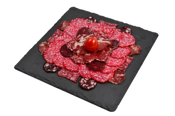 Different kinds of meat cuts on the boards. On a wooden background.