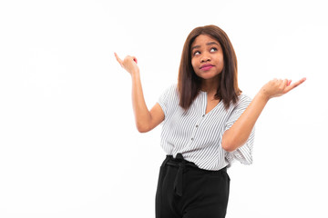 portrait of african young girl possing and gesticulates hands on background