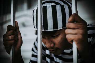 Hands of men desperate to catch the iron prison,prisoner concept,thailand people,Hope to be free.