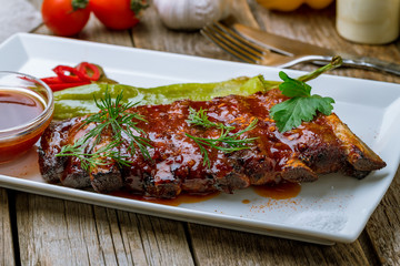 Barbecue pork ribs on wooden background