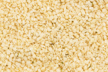Full frame of shelled or peeled hemp seeds for background