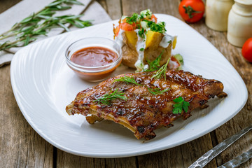 Barbecue pork ribs on wooden background