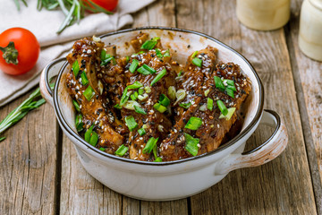 pork ribs in Chinese on wooden background