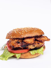 Classic american hamburger on a wooden board, white background