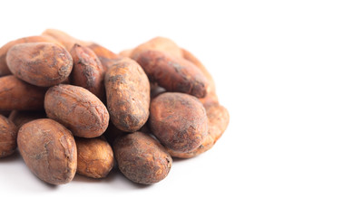 Obraz premium Pile of Raw Cocoa Beans Isolated on a White Background