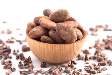 Bowl of Raw Cocoa Beans and Chocolate Nibs Isolated on a White Background