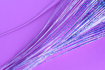 Pink background with holographic fantasy: magic mermaid hair, octopus,  unicorn tail. Shiny sparkle abstract diagonal lines.