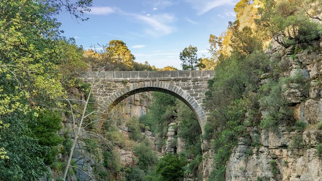 Antique Oluk Bridge across Kopru Irmagi creek in Koprulu Kanyon national park in Turkey