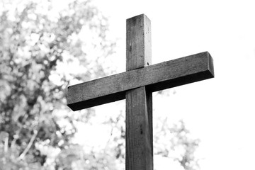 Black-and-white photo with wooden cross