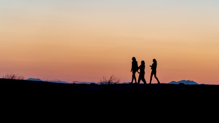 Fototapeta na wymiar Unidentified people silhouette walking during sunset in Side, Antalya, Turkey