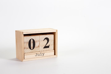 Wooden calendar July 02 on a white background