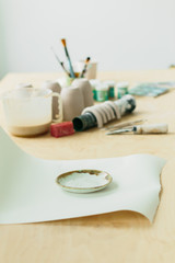 ceramic plate made on a Potter's wheel on a wooden table