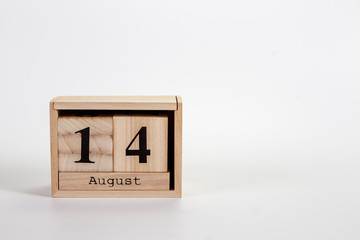 Wooden calendar August 14 on a white background