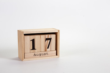 Wooden calendar August 17 on a white background