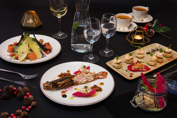 Tasty restaurant dishes: Cooked and stuffed crayfish, salad, appetizers, and crayfish ice-cream