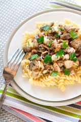 Spiral pasta with morel mushrooms on a plate