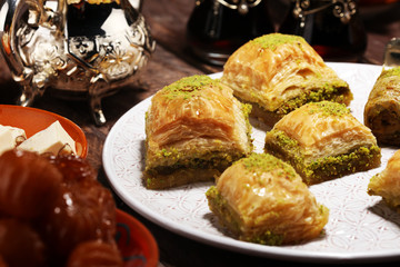 Middle eastern or arabic dishes. Turkish Dessert Baklava with pistachio on dishes
