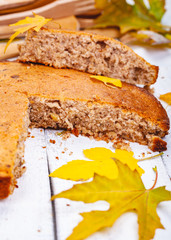 Semolina cake or manna pie with walnuts and raisins on wooden rustic table. Close up